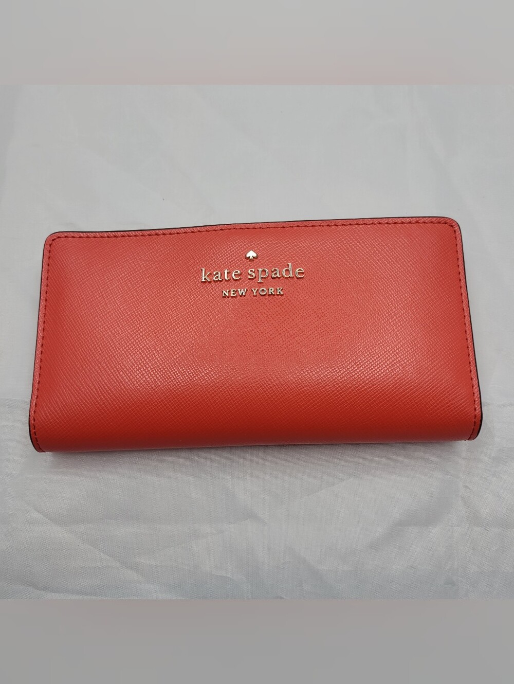 kate spade Coral Large Bifold Wallet with gold logo